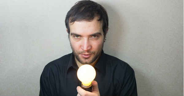 man with an idea holding a lightbulb