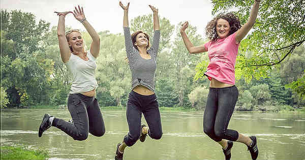 three women joyfully jumping feeling grateful